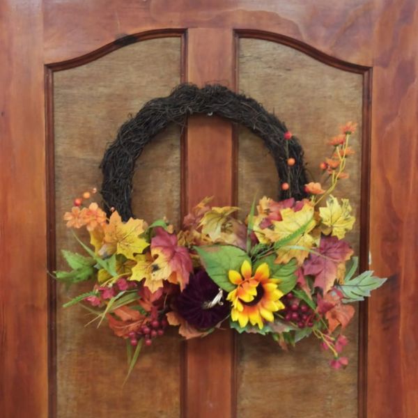 Autumn Basket Wreath on Door with pumpkins, fall foliage and sunflower 