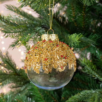 transparent bauble with gold and red details