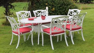 White cast aluminium 6 seater with red cushions