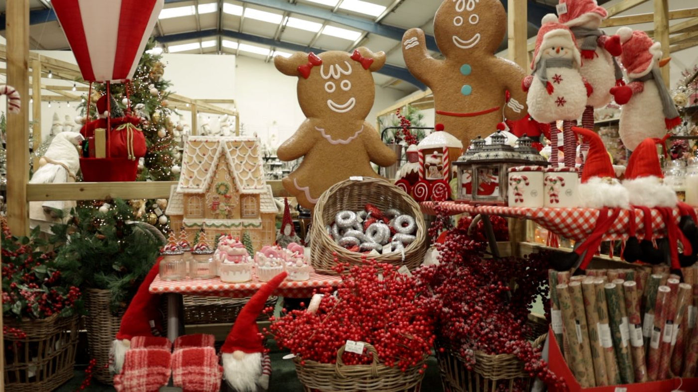 Christmas Display of Gingerbread men and house with red Christmas decorations.