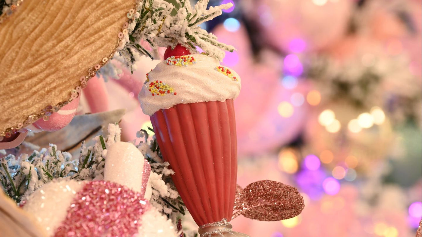 Glass pink milkshake Christmas tree decoration on pink decorated Christmas tree