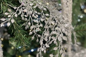 Silver Floristry Stem on Green Artificial Christmas Tree 
