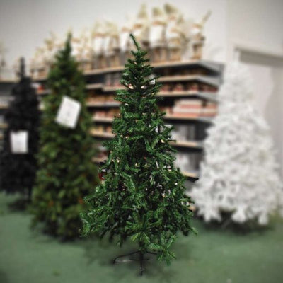 Green Artificial Christmas Tree on Shop Floor