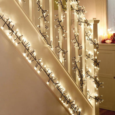 Christmas Cluster Lights wrapped around Stairs
