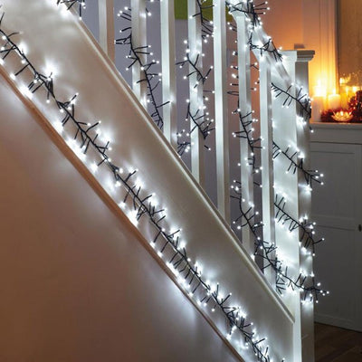 White LED Cluster Multi Function Christmas Lights on Stairway.